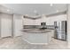 Well-lit kitchen with stainless steel appliances, granite counters and white cabinetry at 2456 Bagnara Pl, Henderson, NV 89044