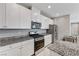 Kitchen featuring granite counters, stainless steel appliances and ample counterspace at 2456 Bagnara Pl, Henderson, NV 89044