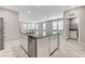 Open kitchen with granite counters, stainless appliances and access to living room at 2456 Bagnara Pl, Henderson, NV 89044