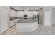 Well-lit kitchen with stainless steel appliances, granite counters and white cabinetry at 2456 Bagnara Pl, Henderson, NV 89044