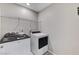 Laundry room equipped with modern washer and dryer for added convenience at 2456 Bagnara Pl, Henderson, NV 89044