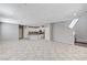 Open-concept living space and kitchen with tile flooring and an abundance of natural light at 2456 Bagnara Pl, Henderson, NV 89044