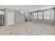 Open-concept living space with tile flooring and a view of the staircase to the upper level at 2456 Bagnara Pl, Henderson, NV 89044