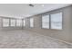 Spacious living room with tile floors and large windows providing ample natural light at 2456 Bagnara Pl, Henderson, NV 89044