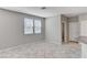 Neutral living room featuring tile floors, lots of light, and plenty of space at 2456 Bagnara Pl, Henderson, NV 89044