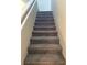 Carpeted stairway leading to the upper level of the home at 2456 Bagnara Pl, Henderson, NV 89044