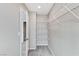 A bright walk-in closet features adjustable wire shelving for ample storage and organization solutions at 2456 Bagnara Pl, Henderson, NV 89044