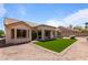 Single story home featuring artificial turf, gravel landscaping, and a covered back patio at 2913 Hawksdale Dr, Las Vegas, NV 89134