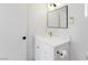 Modern bathroom featuring white vanity, gold fixtures, and a sleek, frameless mirror at 2913 Hawksdale Dr, Las Vegas, NV 89134