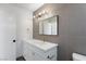 Modern bathroom featuring white cabinets, countertop, and gold fixtures at 2913 Hawksdale Dr, Las Vegas, NV 89134
