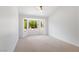 Cozy bedroom with large bay window showcasing a lush, private yard at 2913 Hawksdale Dr, Las Vegas, NV 89134