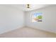 Bright bedroom with a ceiling fan and large window offering neighborhood views at 2913 Hawksdale Dr, Las Vegas, NV 89134