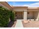 Inviting front entrance with double doors framed by desert landscaping and a terracotta tiled roof at 2913 Hawksdale Dr, Las Vegas, NV 89134