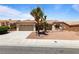 Lovely one-story home with a terracotta tiled roof and a two-car garage at 2913 Hawksdale Dr, Las Vegas, NV 89134