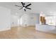 Spacious living room with hardwood floors, neutral paint, and a view into the kitchen area at 2913 Hawksdale Dr, Las Vegas, NV 89134