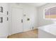 Practical mud room with hardwood floors, lots of storage, and access to the garage at 2913 Hawksdale Dr, Las Vegas, NV 89134