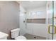 Glass enclosed shower with gray tile accents, and gold hardware at 2913 Hawksdale Dr, Las Vegas, NV 89134