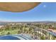 Stunning balcony view overlooking lush trees, neighborhood, and a vast landscape under a clear blue sky at 3111 Bel Air Dr # 16D, Las Vegas, NV 89109