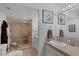 Well-lit bathroom with tiled shower, neutral decor, and modern fixtures at 3111 Bel Air Dr # 16D, Las Vegas, NV 89109