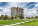 View of the condo building and grounds at 3111 Bel Air Dr # 16D, Las Vegas, NV 89109