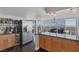 Open kitchen with breakfast bar features stainless appliances and great views at 3111 Bel Air Dr # 16D, Las Vegas, NV 89109