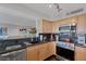 Kitchen featuring stainless appliances, granite counters, and wood cabinets at 3111 Bel Air Dr # 16D, Las Vegas, NV 89109