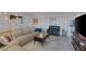 Comfortable living room showcasing tile flooring, modern decor, and ample seating at 3111 Bel Air Dr # 16D, Las Vegas, NV 89109