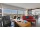 Comfortable living room with floor-to-ceiling windows showcasing panoramic city views and an open floor plan at 3111 Bel Air Dr # 16D, Las Vegas, NV 89109