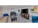 Bright living room features tile flooring, contemporary decor, and an entertainment center at 3111 Bel Air Dr # 16D, Las Vegas, NV 89109