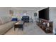 Spacious living room features tile flooring, modern decor, an entertainment center and abundant space at 3111 Bel Air Dr # 16D, Las Vegas, NV 89109