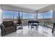 Bright living room featuring floor to ceiling windows with beautiful views, a piano, and comfortable seating at 3111 Bel Air Dr # 16D, Las Vegas, NV 89109