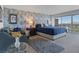 Spacious main bedroom featuring seating area, soft carpet, and large windows with city views at 3111 Bel Air Dr # 16D, Las Vegas, NV 89109