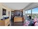 Bright office space with a Murphy bed, built-in bookshelves, and a balcony offering stunning city views at 3111 Bel Air Dr # 16D, Las Vegas, NV 89109