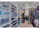 Spacious walk-in closet with custom shelving and ample storage space for clothes, shoes, and accessories at 3111 Bel Air Dr # 16D, Las Vegas, NV 89109