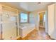 Bathroom with shower and a bath at 3743 Prairie Orchid Ave, North Las Vegas, NV 89081