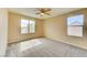 Bedroom with soft carpet and dual windows at 3743 Prairie Orchid Ave, North Las Vegas, NV 89081