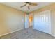 This bedroom offers soft carpet, a ceiling fan and double door closet at 3743 Prairie Orchid Ave, North Las Vegas, NV 89081