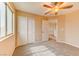 Bedroom featuring soft carpets, fan and closet space at 3743 Prairie Orchid Ave, North Las Vegas, NV 89081
