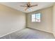 Bedroom featuring carpeted floors, a ceiling fan, and a window providing natural light at 3743 Prairie Orchid Ave, North Las Vegas, NV 89081