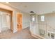 Carpeted second floor hallway with a view of a bathroom and bedrooms at 3743 Prairie Orchid Ave, North Las Vegas, NV 89081