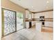 Kitchen with white cabinets and a sliding glass door leading to the pool area at 3743 Prairie Orchid Ave, North Las Vegas, NV 89081