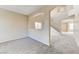 Spacious living room featuring neutral carpet, archways, and staircase at 3743 Prairie Orchid Ave, North Las Vegas, NV 89081