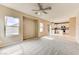 Open-concept living room leading to the kitchen with a ceiling fan at 3743 Prairie Orchid Ave, North Las Vegas, NV 89081
