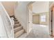 Carpeted staircase with white railings and views to another room at 3743 Prairie Orchid Ave, North Las Vegas, NV 89081