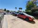 Paved driveway leading to a home, lined with parked vehicles and some greenery at 377 N 16Th St, Las Vegas, NV 89101