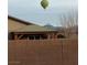 Backyard view showing covered patio, block wall, and distant mountains at 3862 E Summit Ave, Pahrump, NV 89061