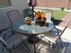Backyard patio features a patio set on a patterned outdoor rug at 3862 E Summit Ave, Pahrump, NV 89061