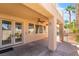 Comfortable back patio with views of the relaxing backyard pool and tropical landscaping at 395 Suzanne Peak Ct, Henderson, NV 89012