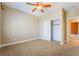 Bedroom featuring carpeted floors, a ceiling fan, and a closet at 395 Suzanne Peak Ct, Henderson, NV 89012