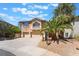Charming two-story home with a well-maintained front yard and three-car garage, perfect for a Gathering at 395 Suzanne Peak Ct, Henderson, NV 89012